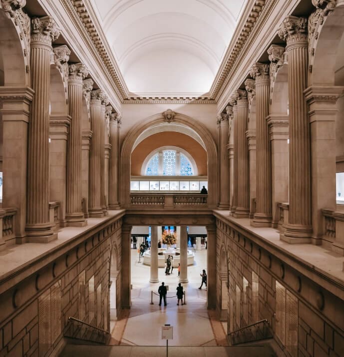 A large hallway with many pillars and columns.